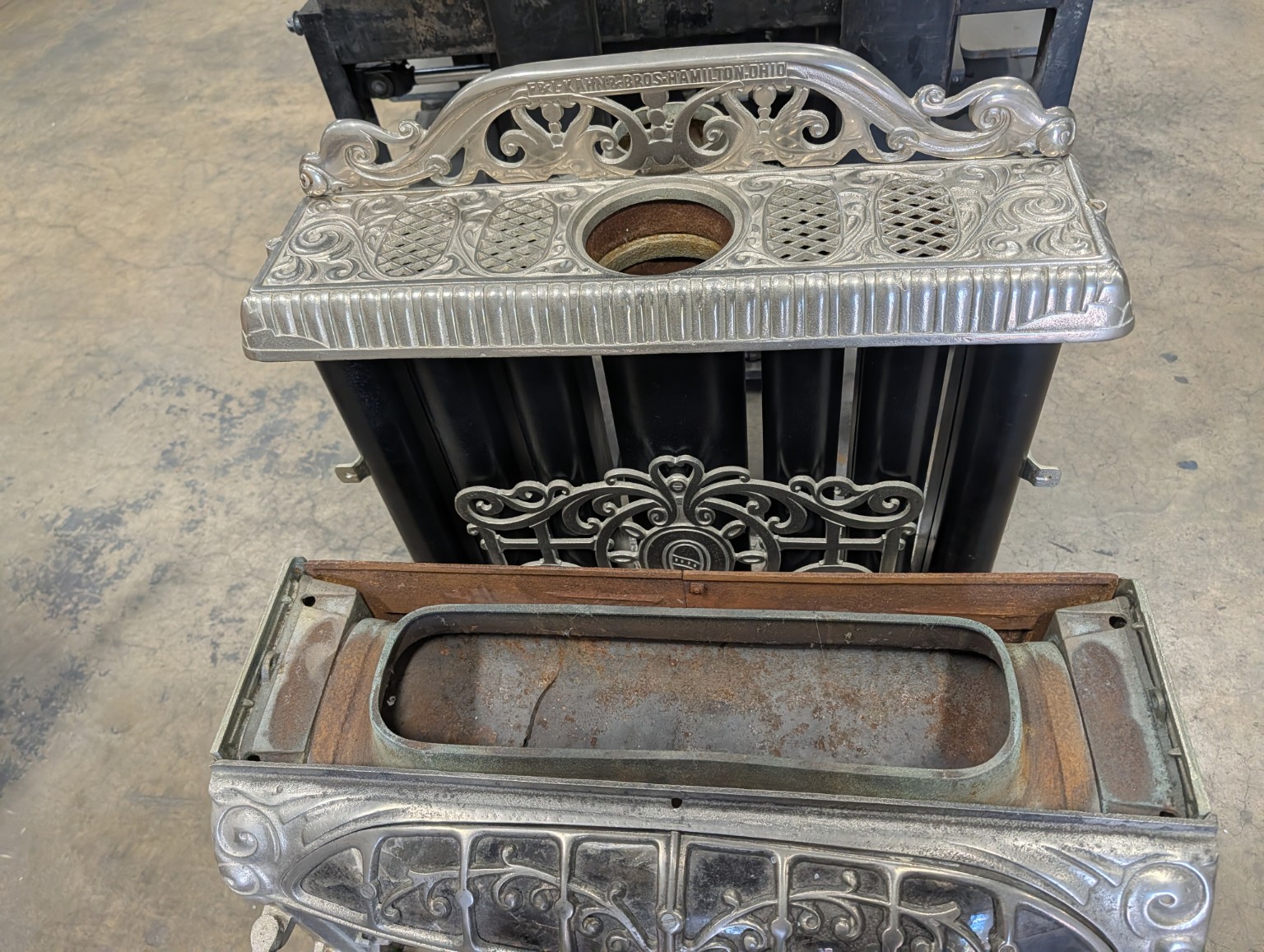 Ornate vintage cast iron fireplace during its restoration